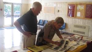 Diane Largey Johnson, Class of 1965, and husband Alan page through the first ECCHS yearbook prior to their school tour on Friday. The couple traveled from Plano, Texas to celebrate the 50th Anniversary of the school.