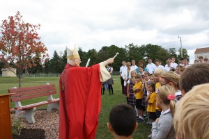 Bishop Donald Trautman blesses the congregation and the school as part of the rededication of ECCHS.