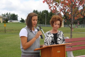 Senior Taylor DaCanal says a few words during the rededication of ECCHS as Principal Sandy Florig looks on.